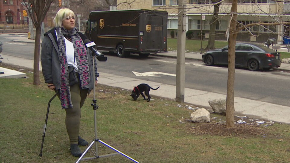 Mars Delgado stands before a microphone, stick in hand.