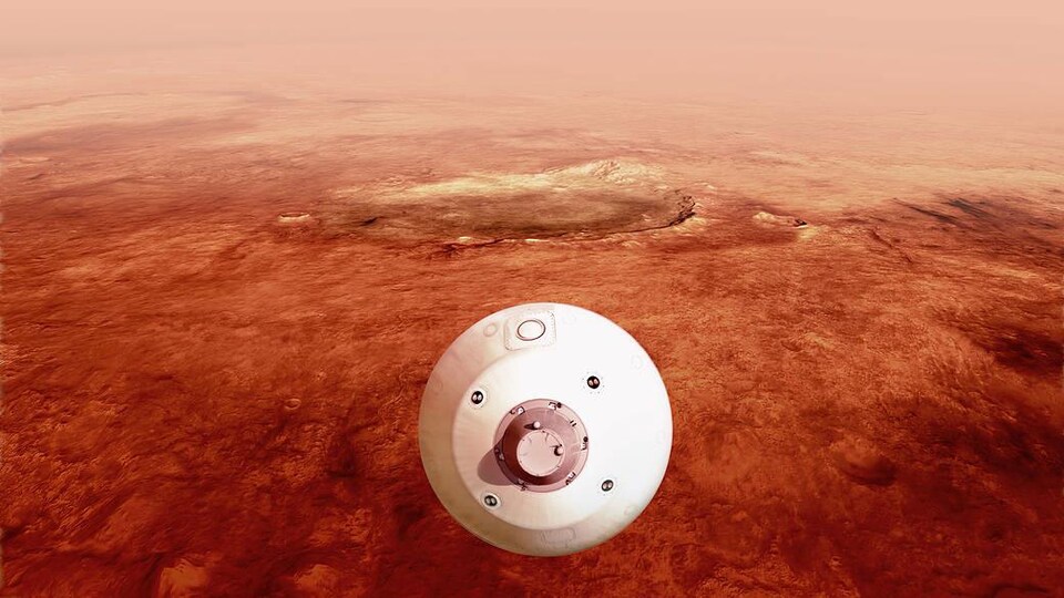 Le bouclier thermique enveloppant le rover Perseverance se dirige vers la surface martienne en descendant dans l'atmosphère (illustration artistique).