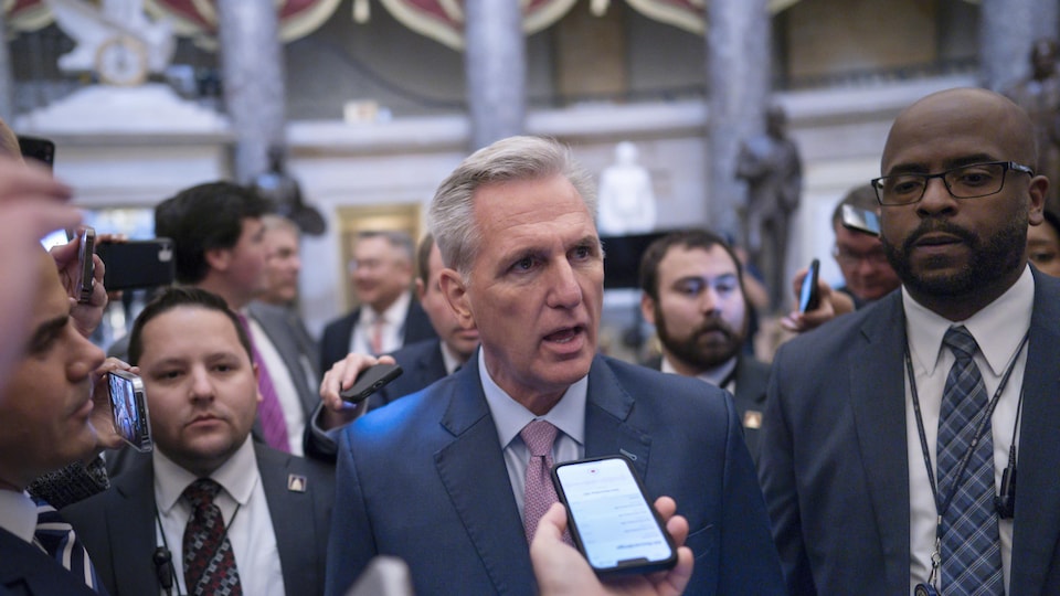 Republican Congressman Kevin McCarthy answers questions from reporters in the House of Representatives.