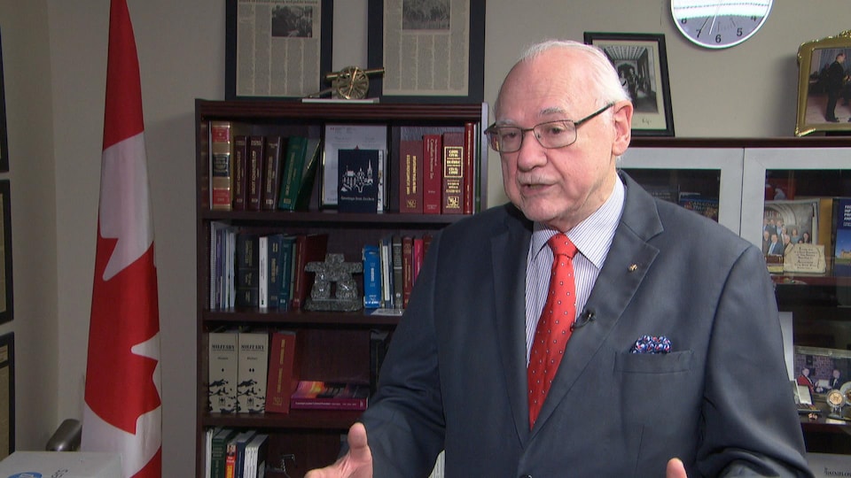 Michel Drapeau explained his view in front of the library in his office.