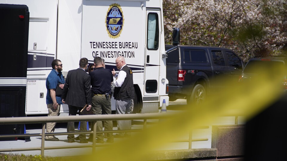 Tennessee Bureau of Investigation agents in front of a command post.
