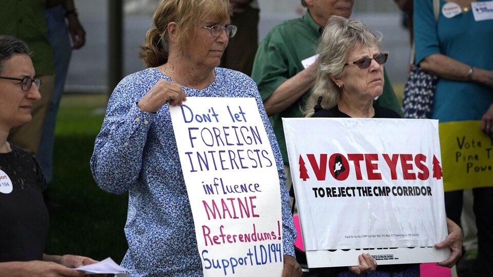 Protesters at a press conference