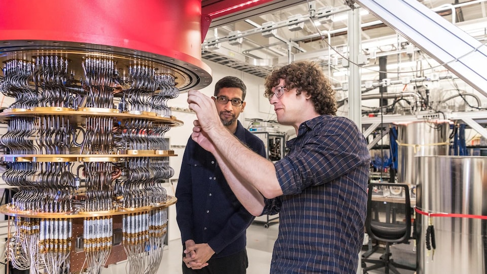 A handout picture from October 2019 shows Sundar Pichai and Daniel Sank (R) with one of Google's Quantum Computers in the Santa Barbara lab, California, U.S. Picture taken in October 2019.      Google/Handout via REUTERS        THIS IMAGE HAS BEEN SUPPLIED BY A THIRD PARTY. - RC12ADEBF8D0
