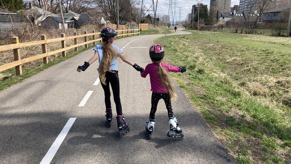 Two girls in inline skates.