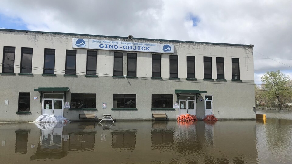 A view of the building with sandbags in front of the exterior doors.