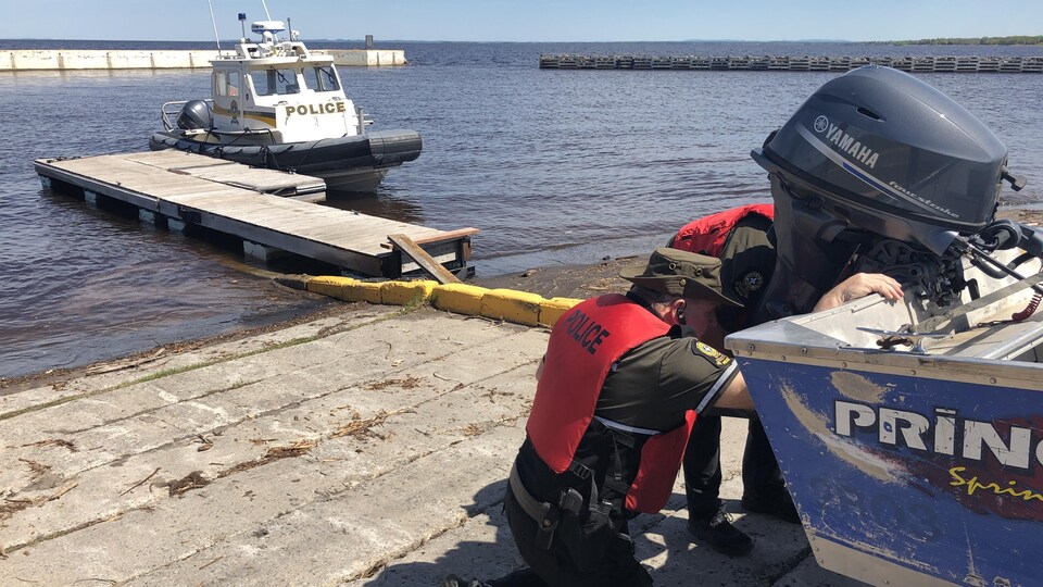 Police were busy putting the boat in the water.