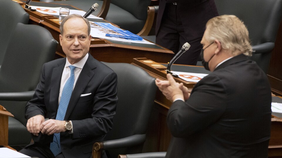 Peter Bethlenfalvy watches Doug Ford in the Legislative Assembly.