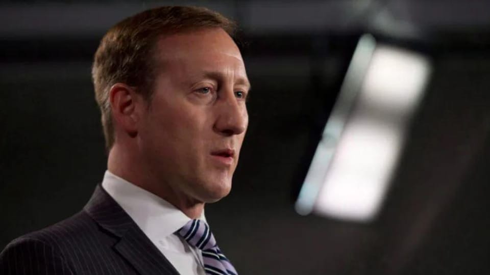 Peter Mackay at a press conference.