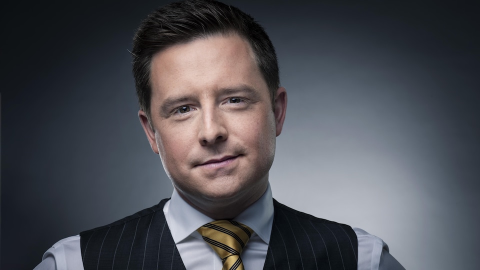 A dark-haired man tied up was posing.