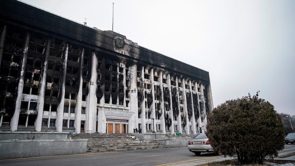 The facade of a building consumed by fire. 