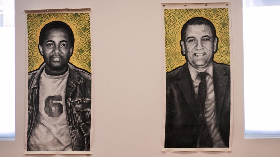 Des peintures illustrant les visages d'Ibrahima Barry et de Hassane Abdelkrim.
