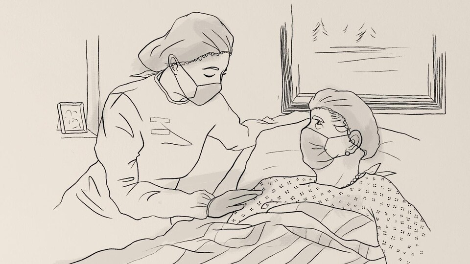 Une femme portant un masque de protection réconforte un patient portant lui aussi un masque de protection, couché dans son lit