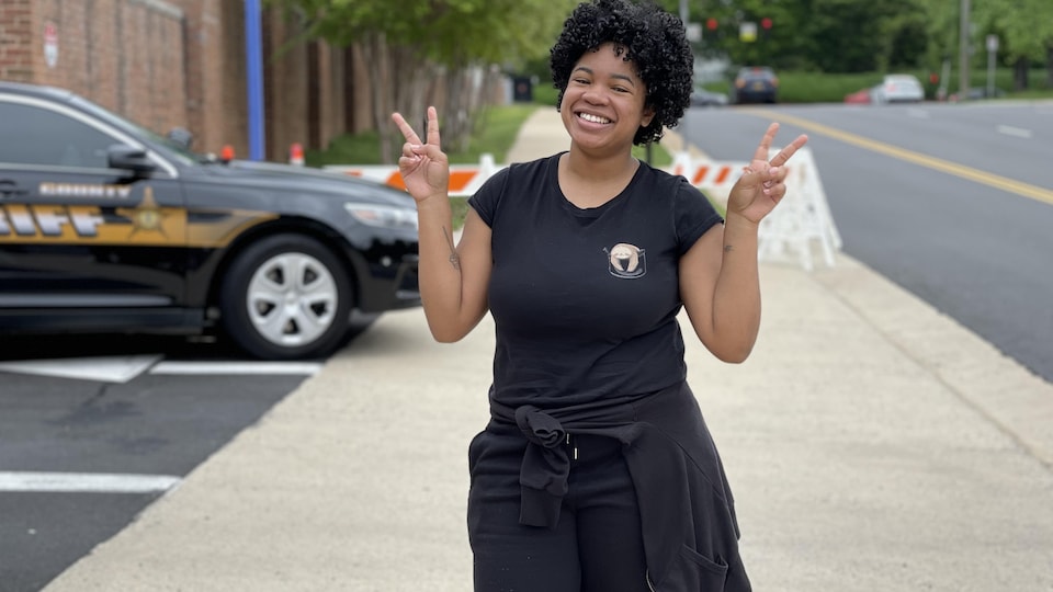 Jaye Jefferson smiled, making a peace sign with the fingers of each hand.