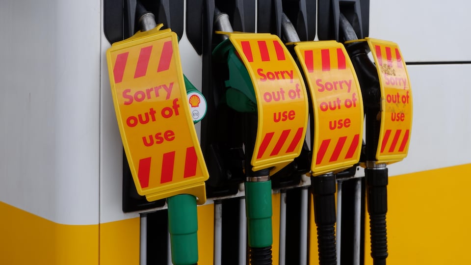 Petrol pumps with apology message for malfunction.