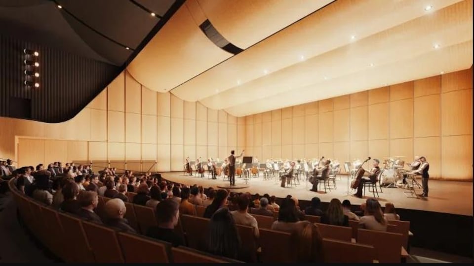 Une salle avec un orchestre et un publc.