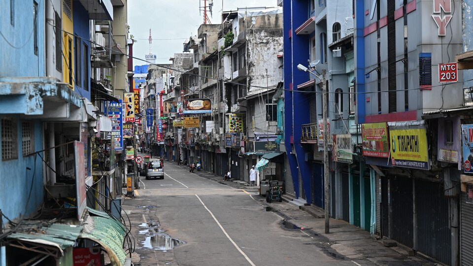 Closed shops along a deserted street in Colombo.