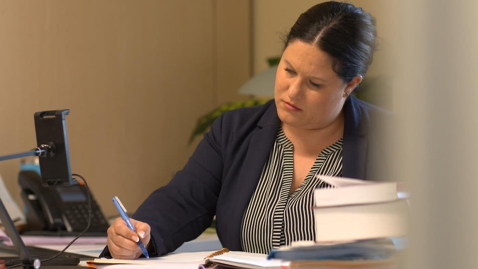 Alisa Lombard at her desk.