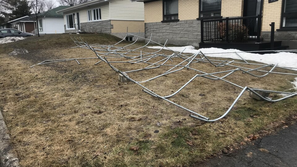 The structure of this carport is lifted by the wind.