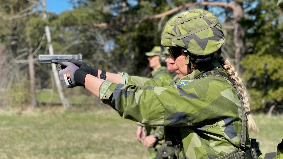 Camilla was holding a gun.