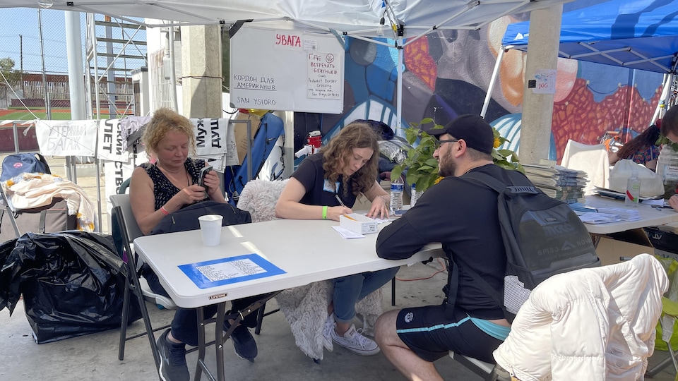 People are sitting at a table.