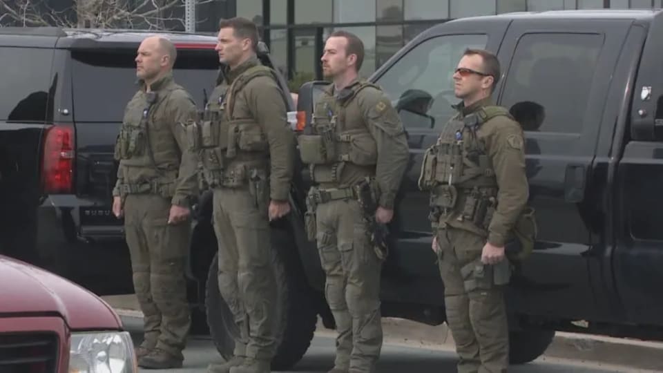 Four officers stood up straight.