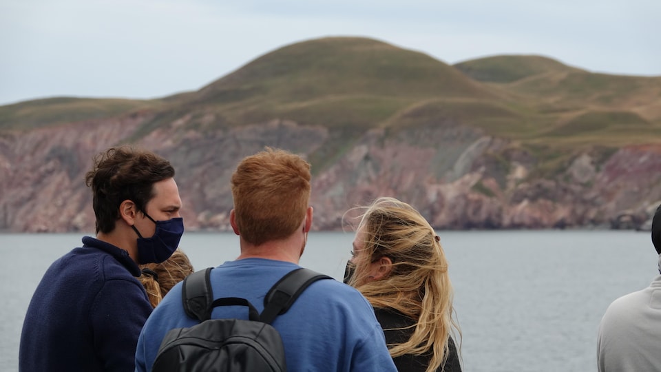 Masked spectators see the entrance island.