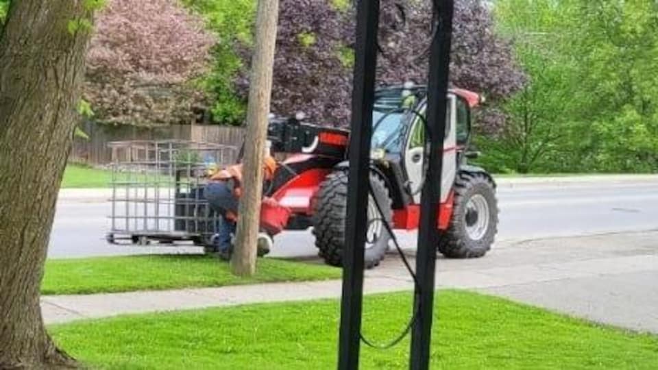 A red tractor and a man.