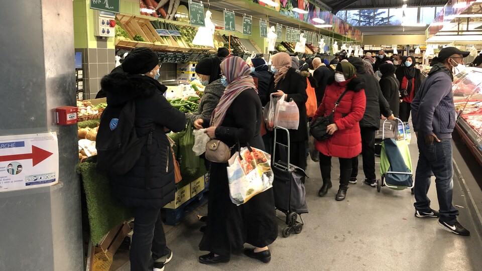 Customers in a food store in Trappes