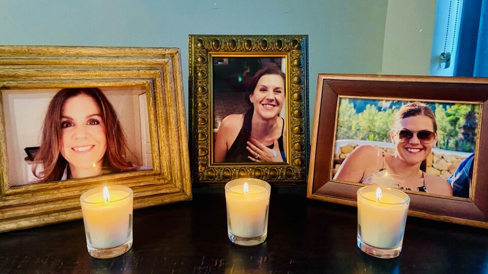 Des chandelles éclairent des photos de Trina Hunt, portée disparue.