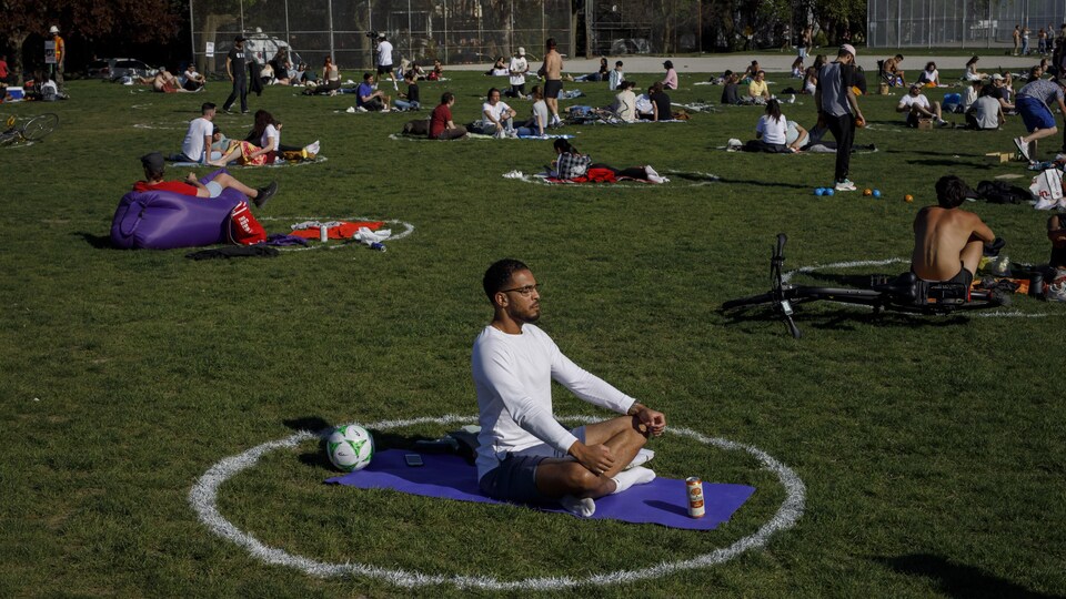 People use social distancing circles at Trinity-Bellwoods park in Toronto, on Thursday, May 13, 2021. THE CANADIAN PRESS/Cole Burston