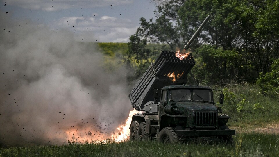 A missile is fired from a multiple launch rocket system.