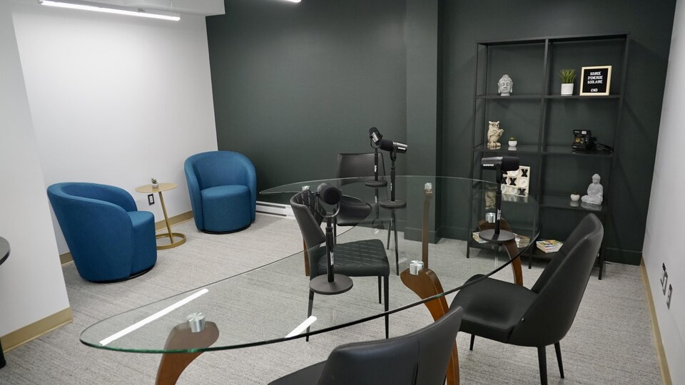 IDEAS Universe room with glass table and microphones.           