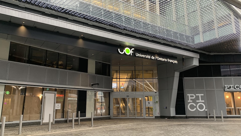 The UOF sign in front of the building.