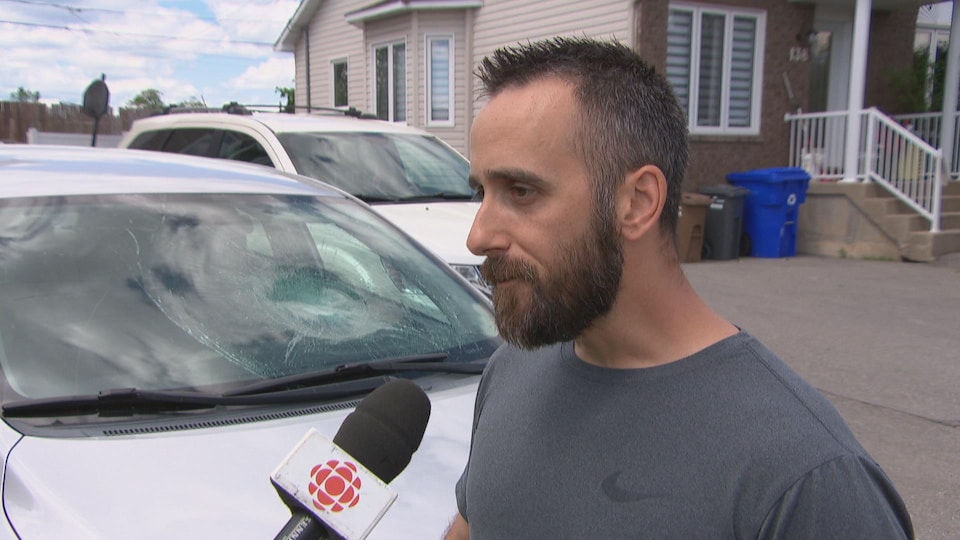 A man gives an interview to the camera.