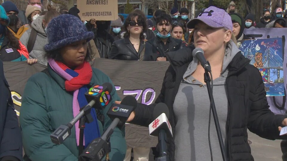 Brandy Schlemko in front of the microphones at a press briefing.