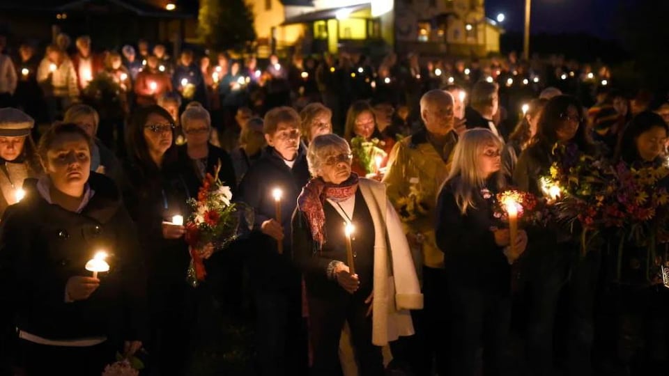 Hundreds of people were holding candles