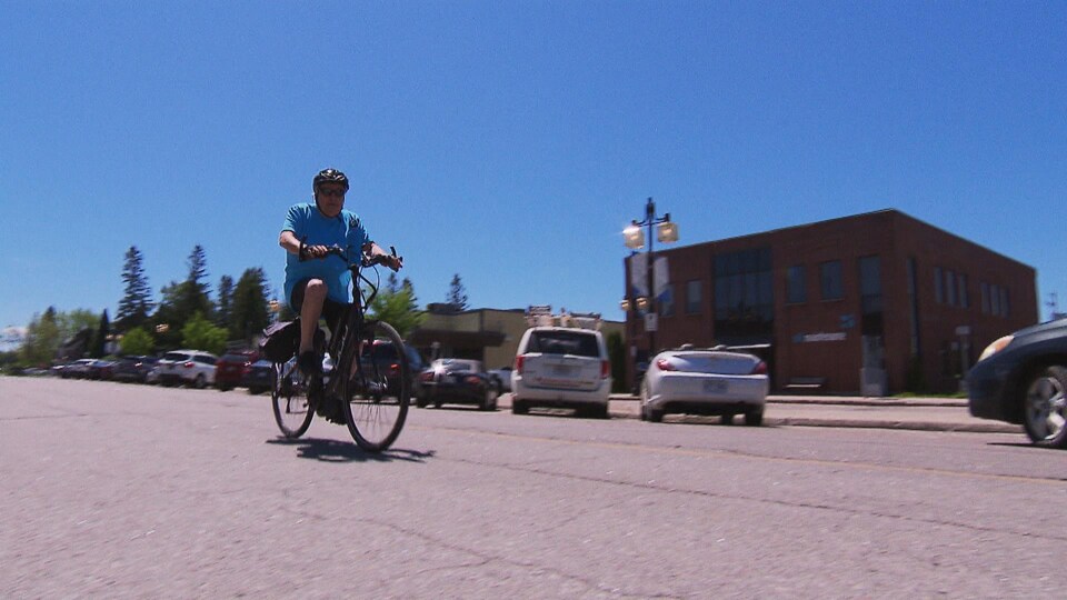 A man riding a bicycle.