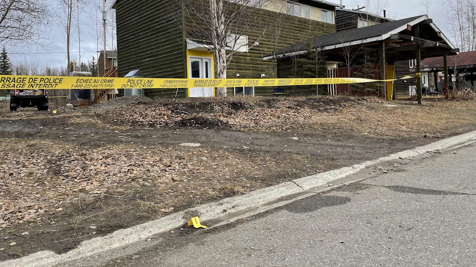 A police tape marked a no-go zone around a house.