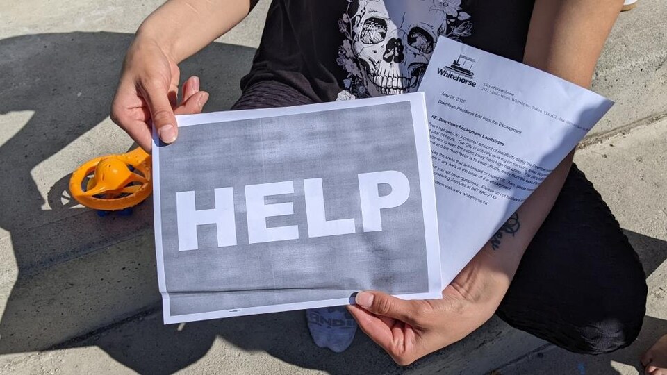 A man is holding information documents in his hands.  Photo taken near May 28, 2022.