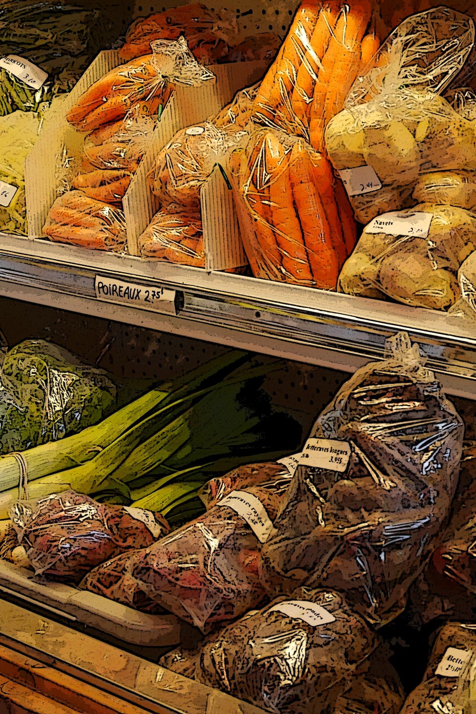 Un comptoir réfrigéré contenant des légumes.