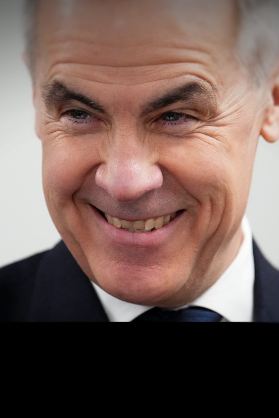 Mark Carney sourit.