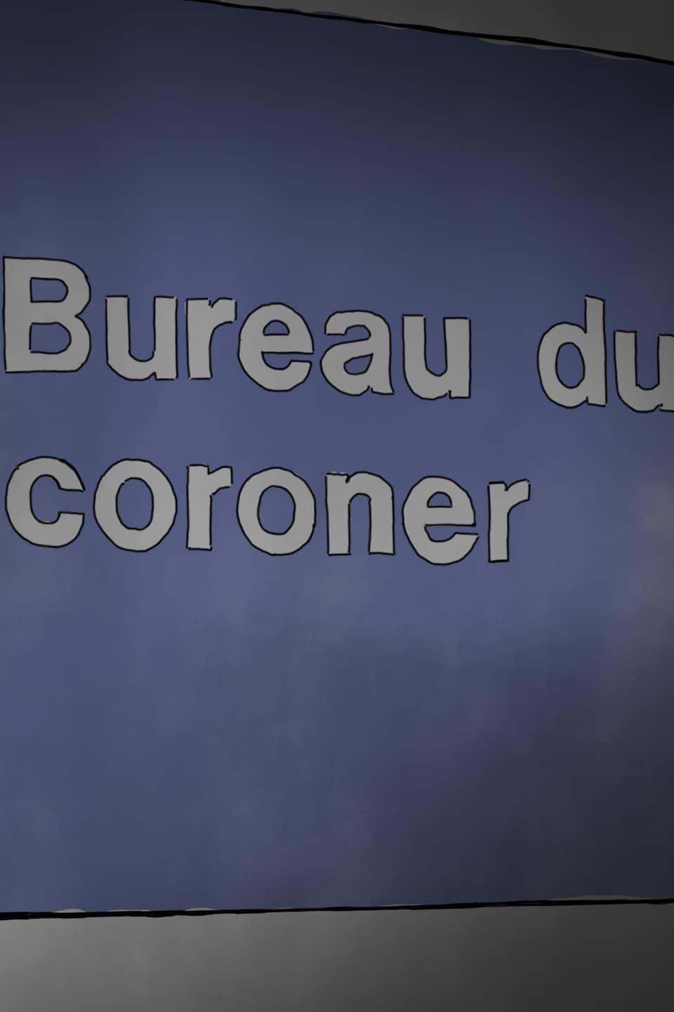 Un homme travaille à l'ordinateur au Bureau du coroner.