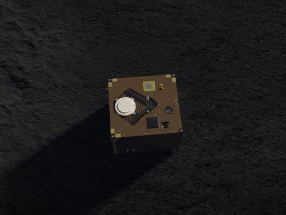 Représentation artistique du robot MASCOT à la surface de Ryugu. 