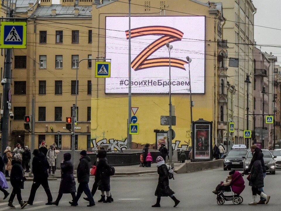 A poster showing the Z symbol on a wall.