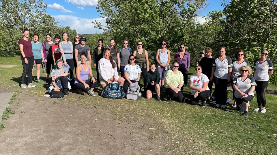 Several women from the association pose for a group photo in Rundle Park. 