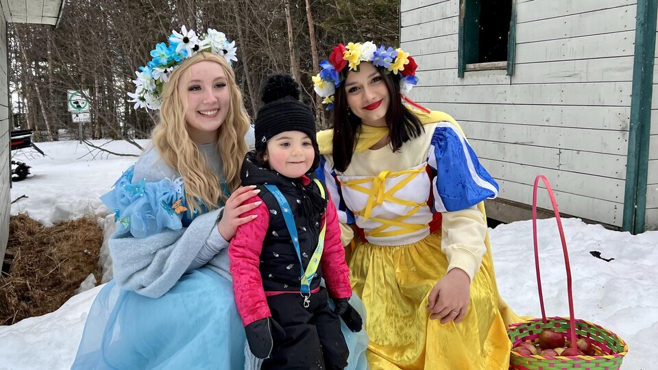 Charlotte Caron and two people dressed as princesses. 