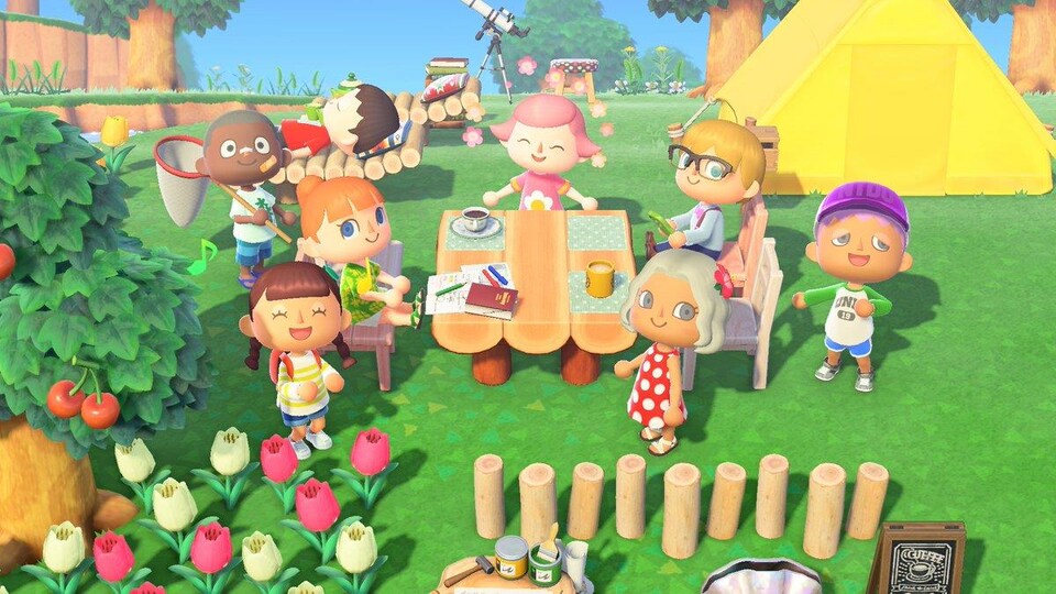 Plusieurs personnages du jeu vidéo « Animal Crossing » sont réunis autour d'une table en bois, à l'extérieur, et mangent ensemble. 