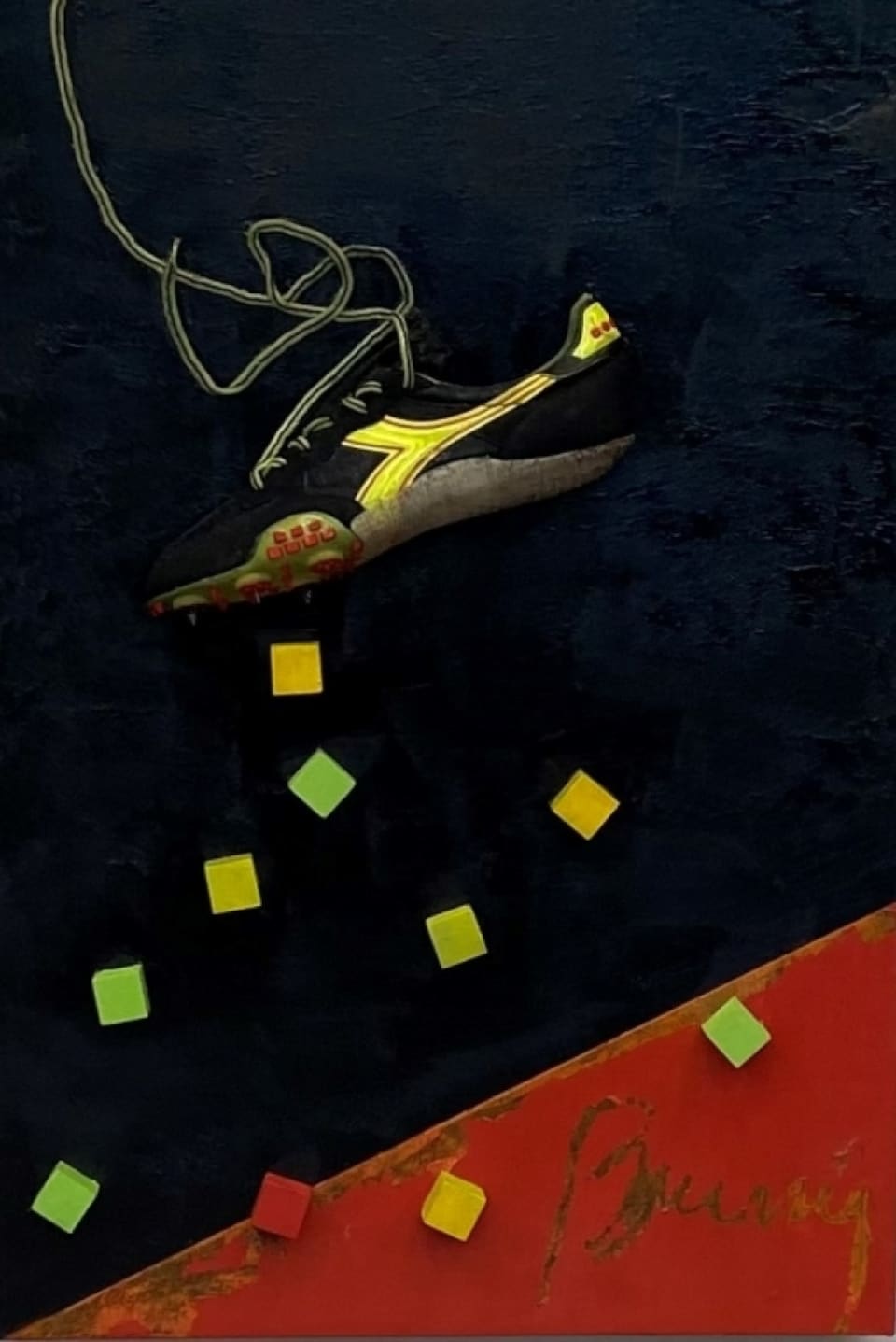 A shoe, with colored dots, on a dark blue and red background.