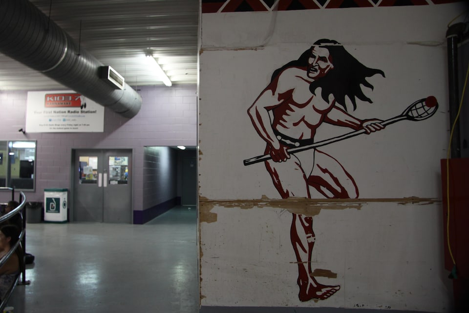 Painted mural depicting a lacrosse player in action.