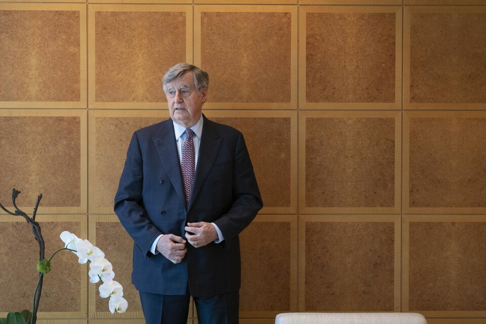 Mr.  Bouchard stood, fastening his jacket.